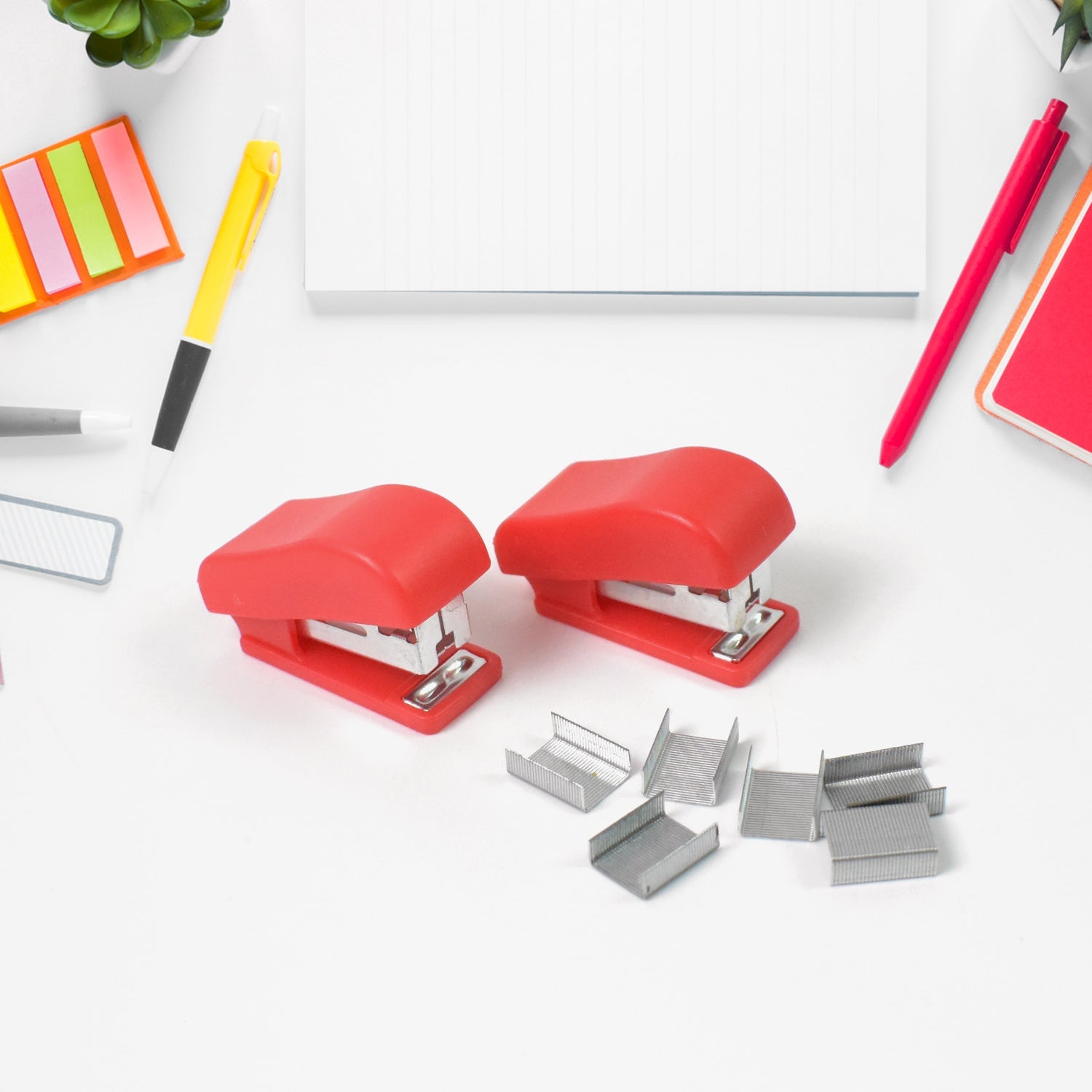 A single vibrant red mini stapler from the FiloDesk portable stapler set.