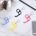 Dual-finger mobile stand keyring in mixed vibrant color holding a smartphone securely