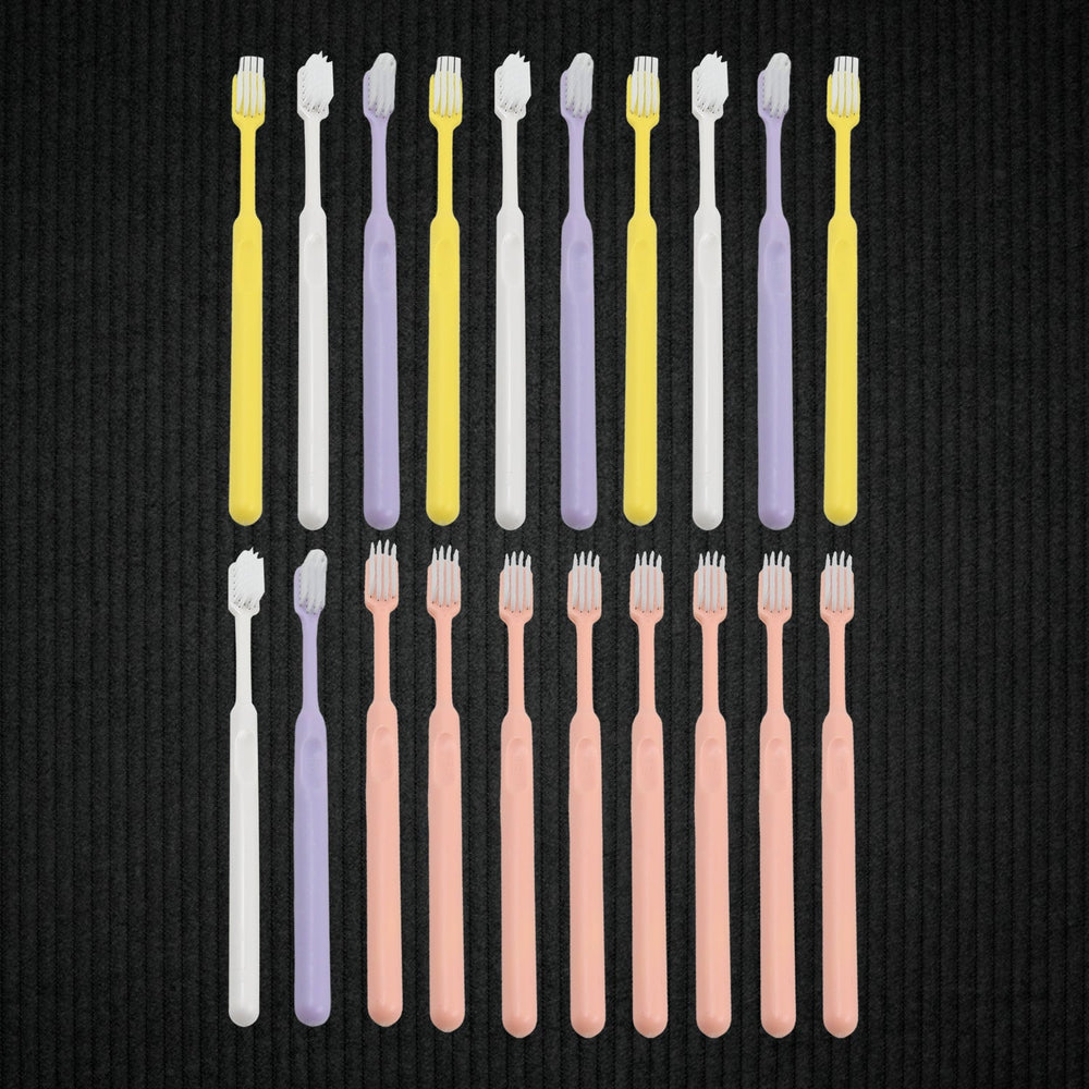Detailed view of the ultra-soft bristles on a plastic toothbrush, designed for gentle yet effective cleaning.