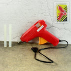Professional 60W hot melt glue gun with included glue stick.