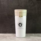 Close-up of stainless steel vacuum insulated coffee flask showing specifications