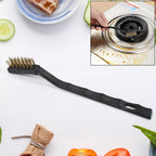 Mini Brass Wire Brush for cleaning and rust removal, held against a white background.