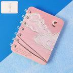 Mini spiral bound pocket notebook with cloud and moon artistic cover