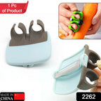 Compact Palm Peeler held in hand, ready for fruit and vegetable preparation.