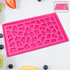 Lightweight plastic serving tray with hollow geometric design on countertop