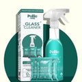 Concentrated glass cleaner refill sachets and reusable spray bottle on a white background.