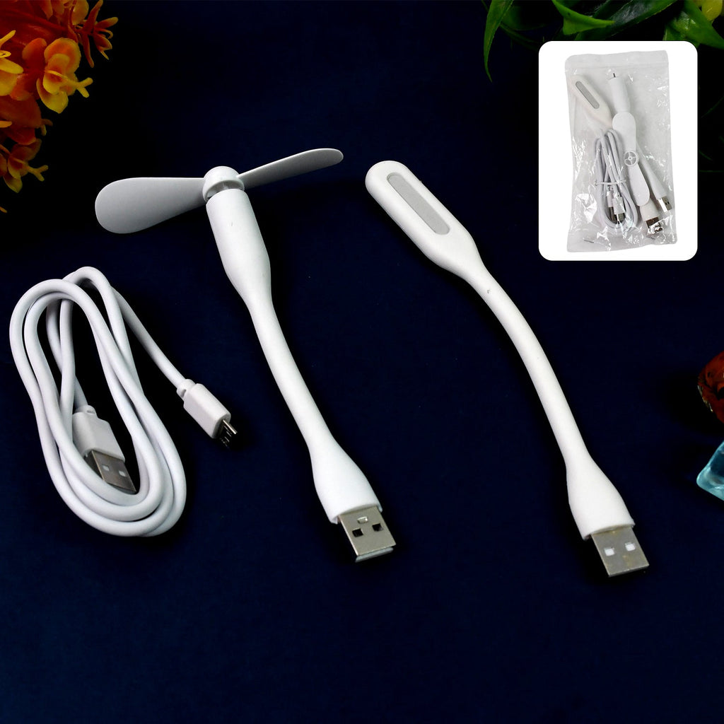 A person holding the mini USB fan, showcasing its small size and ease of handling.