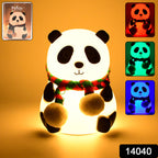 Adorable silicone panda night light with eyes closed, perfect for a child's bedroom.