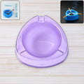 Transparent purple plastic ashtray with wide bowl and triangular shape