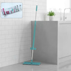 Flat floor cleaning mop with long handle and rectangular mop head on floor