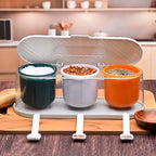 Multicolor 3-grid spice container placed on a modern kitchen counter, ready for use.