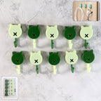 Set of 10 self adhesive round wall hooks showcased in a compact design