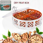 Top-down view of a round silver dry fruit gift box with four sections.