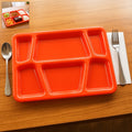 Red plastic multi-compartment rectangular meal serving tray with six sections