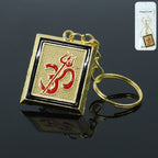 Golden metal Om Trishul keychain front view showcasing intricate spiritual design