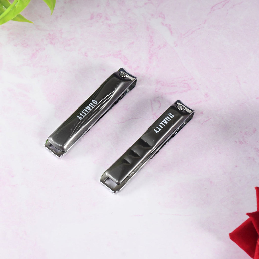 Nail clipper cutting fingernail with sharp blades for precise trimming