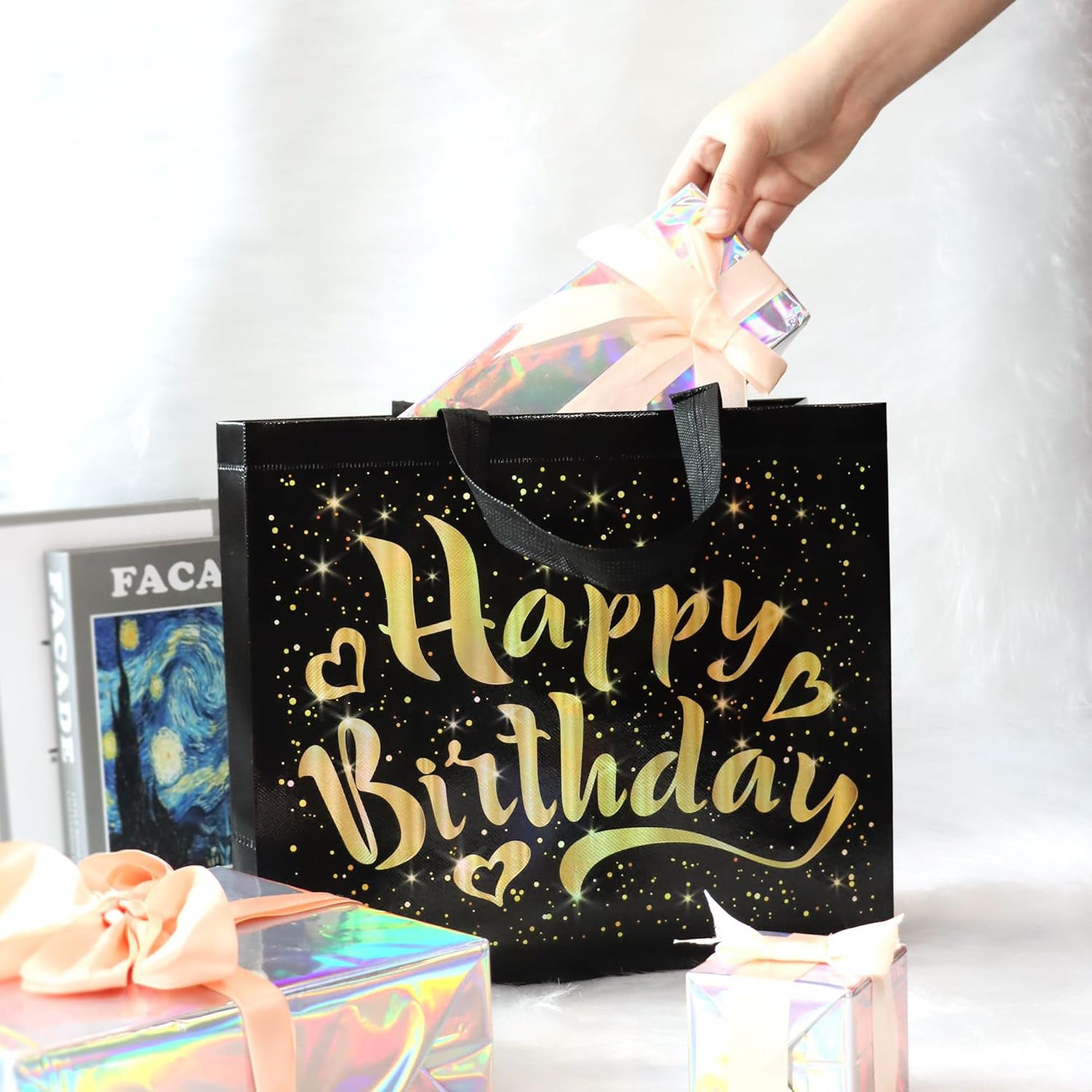 Close-up of golden star design on black reusable birthday gift bag