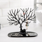 Side view of deer shaped jewellery holder showcasing antler branches and oval tray