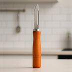 Quickslice wooden handle stainless steel vegetable peeler on a clean white background.