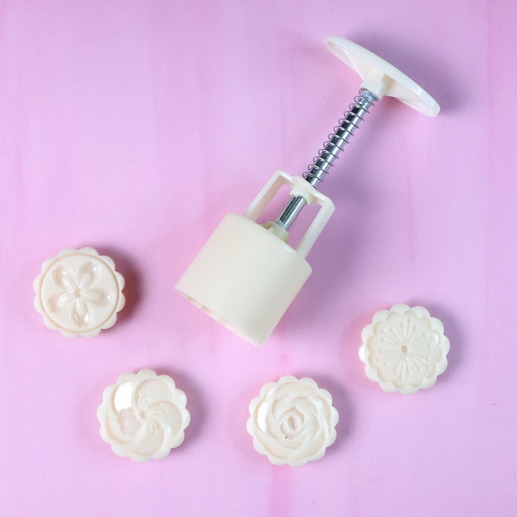 Pastry mold showing clear floral embossing created by spring press