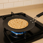 Side profile of flat tawa showing heat-resistant handle