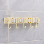 Self-adhesive broom and mop holder rack mounted on wall with utility hooks