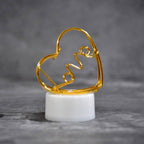 The set of 12 multicolor flameless heart candles displayed in their packaging, ready for gifting or decoration.