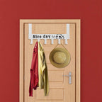Over door rack loaded with clothes and bags showcasing heavy-duty hook strength