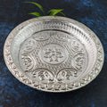 Silver finish plastic pooja thali with embossed floral design on surface
