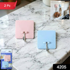 Two heavy-duty wall-mounted utility hooks side by side