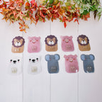 Fun and colorful cartoon hooks mounted on the wall for kids' playroom