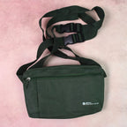 Person comfortably carrying the Hajj shoulder bag during travel.