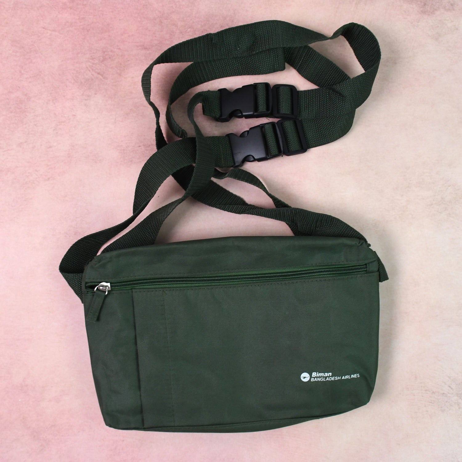 Person comfortably carrying the Hajj shoulder bag during travel.