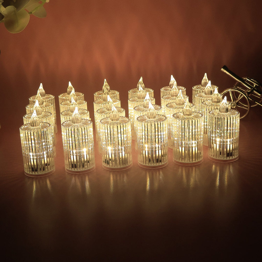 Multiple LED flameless decorative candles arranged showing crystal pattern and warm glow