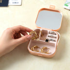 Side view of portable mini jewelry box with built-in mirror