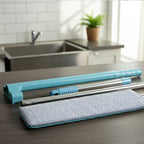 Flat floor cleaning mop reaching under furniture with slim mop head