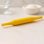 Hands skillfully using the Bombay belan to flatten dough for perfect rotis.