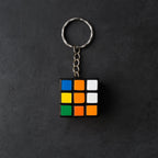 Detailed view of a Mini Magic Cube Puzzle keychain with bright, engaging colours.