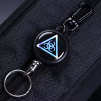 Retractor key chain with steel cable, showcasing its robust build quality.