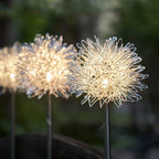 Solar LED dandelion garden lights displaying bright multicolor glow at night