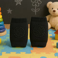Black toddler knee protector made from breathable wool and sponge padding