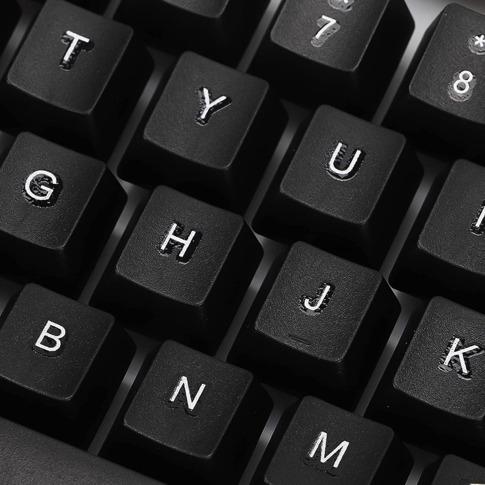 Angled view of the wired keyboard, highlighting its full-size layout and ergonomic key placement.