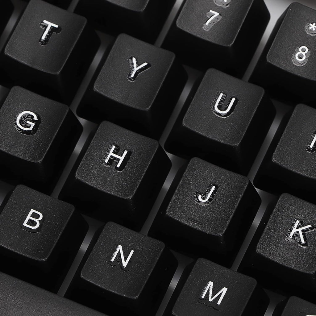 Angled view of the wired keyboard, highlighting its full-size layout and ergonomic key placement.