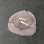 Heat resistant and sturdy plastic ashtray with cigarette grooves