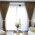 Magnetic curtain tieback twisted to adjust length on window curtain