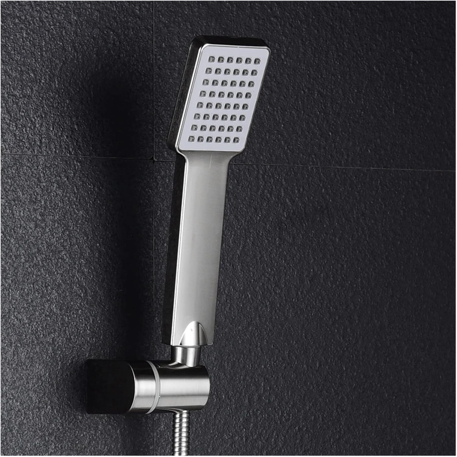 Person holding the handheld shower head, demonstrating its easy grip and versatile use.