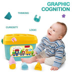 Child sorting a yellow star block into the Baby Shape Sorter bucket, developing motor skills.