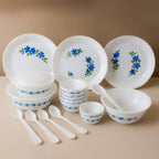 Complete plastic dinner set with blue flower design on white plates