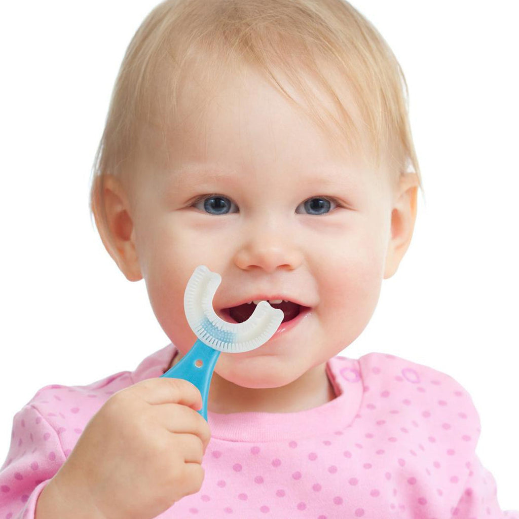 Toddler toothbrush with a non-slip handle for independent brushing.