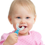 Toddler toothbrush with a non-slip handle for independent brushing.